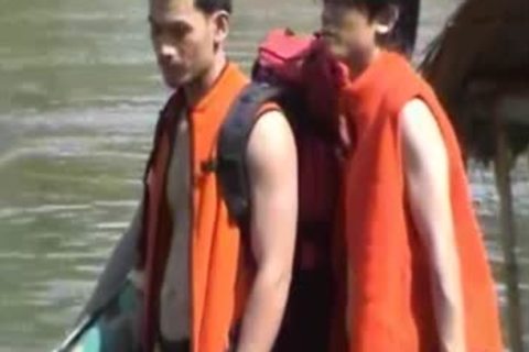 Thai dudes in nature's garb On A River